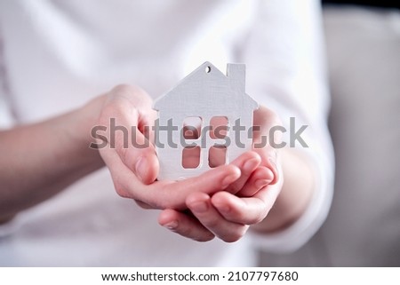 real estate concept, hand holding house