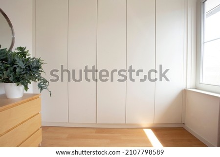 Room with a built in wardrobe white modern design in new house, stylish interior home Royalty-Free Stock Photo #2107798589