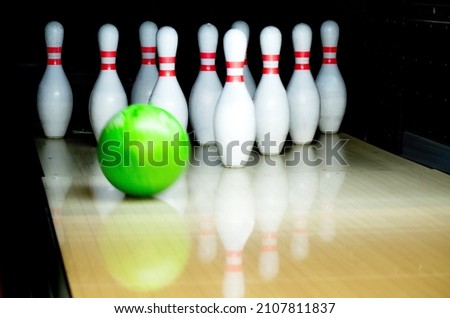 classic white bowling pins with a ball