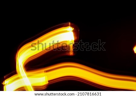 Traffic light effect on a dark background. Glare cover for a music album. Working with shutter speed and camera light.