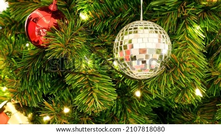 Close up of a blink ball decorated on the Christmas tree with the blink light