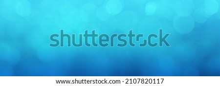 Blue panoramic banner background with lights and bokeh effect. Modern blue design background with copy space