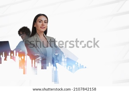 Businessman with laptop and businesswoman with arms crossed. Double exposure of financial chart and candlesticks, toned image, New York city view at night. Concept of cooperation