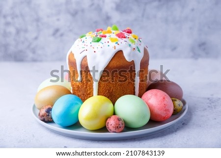 Easter cake with candied fruits and colored eggs. Traditional Easter baking. Easter holiday. Close-up. Royalty-Free Stock Photo #2107843139