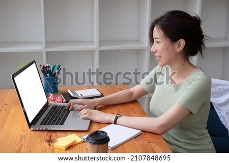 Business woman using laptop in office