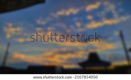 defocused abstract background of orange clouds. Selective focus. Noise. Blurred
