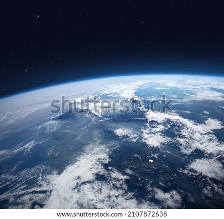 Blue Earth in the space. View of planet Earth from space. Elements of this image furnished by NASA. Royalty-Free Stock Photo #2107872638