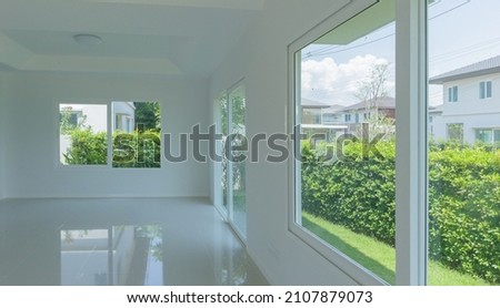 Empty room with glass window frame house interior on concrete wall Royalty-Free Stock Photo #2107879073