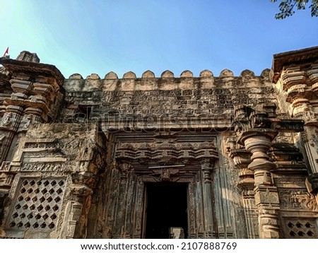 Stock photo of Ancient Hindu temple Kopeshwar Mahadev Mandir Entrance door, Beautiful intricate stone carving around the entrance door of the temple.Picture captured under bright sunlight at Khidrapur