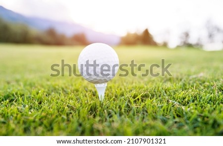 Close up of golf ball on tee.