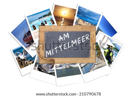 Old slate blackboard with the text message in germans words: AM MITTELMEER lies on a stack of many Vacations instant pictures isolated on white Background