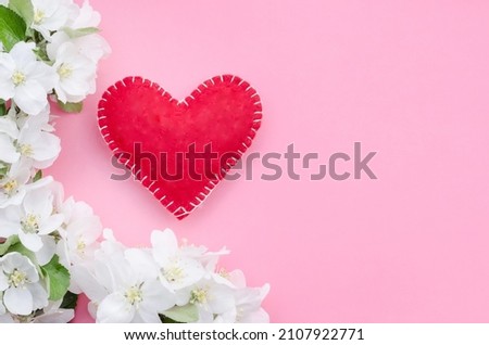 Valentines day card, red heart with a flowers on a pink background