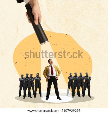 Contemporary art collage. Businessman standing under the light of a flashlight symbolizing successful employee. Winner. concept of leadership, career growth, promotion, motivation, profit