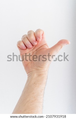 hand of a man with white background doing Passive Finger Flexion. composite. vertical picture