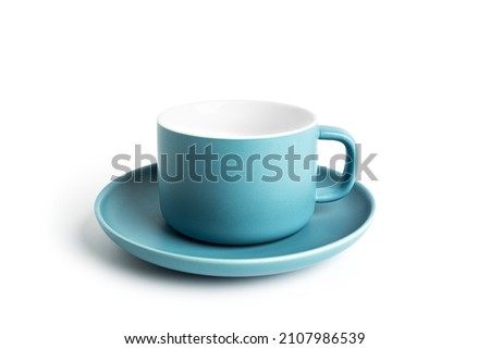 Blue tea cup and saucer for drink isolated on white background. Ceramic coffee cup or mug close up. High quality photo Royalty-Free Stock Photo #2107986539
