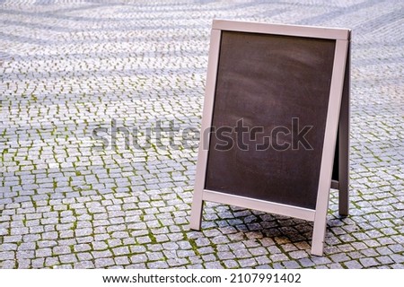 typical blank black board at a restaurant - photo