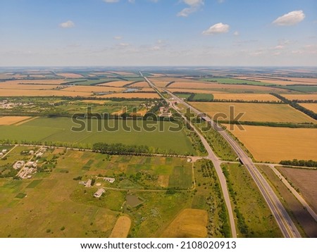Aerial landscape of summer farm wheat field harvest crops