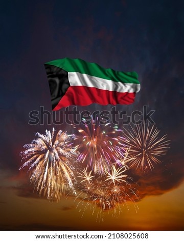 Holiday fireworks in evening sky and flag of Kuwait for National Independence day Royalty-Free Stock Photo #2108025608