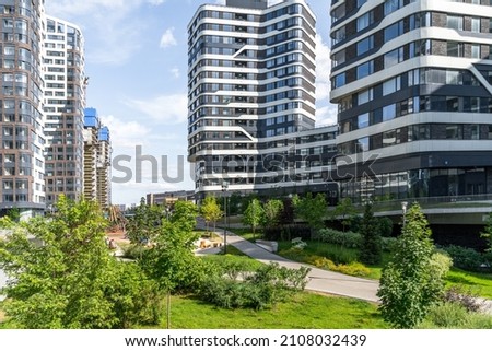 New , modern residential areas of Moscow . Modern landscaping and landscaping of house territories and courtyards of residential complexes .  Royalty-Free Stock Photo #2108032439