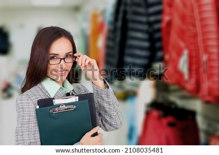Clothing Store, Female Visual Merchandising Professional posing