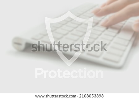Safety computer security concept. Internet protection symbol on blured keyboard background. Concept image of security vulnerability and information leaks