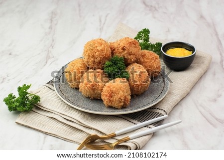 Bitterballen is Dutch Snack Made from a Round Shaped Dough Filled with Mozzarella Cheese, Served with Mustard Royalty-Free Stock Photo #2108102174