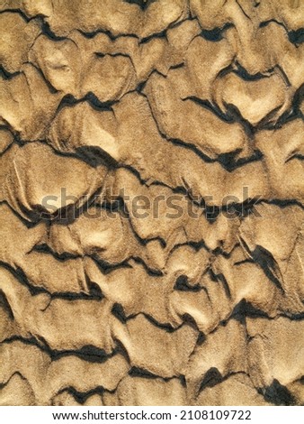 Wavy pattern in the sand of beach, Cadiz province, Andalusia, Spain