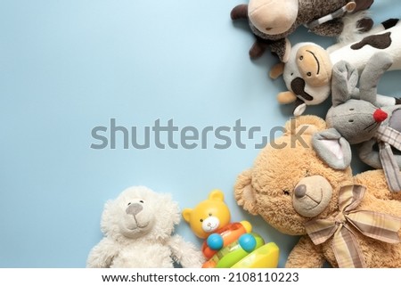 Children's toys on the blue background Royalty-Free Stock Photo #2108110223
