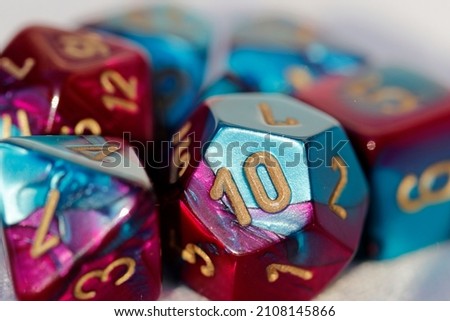 D20 dice, teal fuschia pink, numbers, Dungeons and Dragons Royalty-Free Stock Photo #2108145866