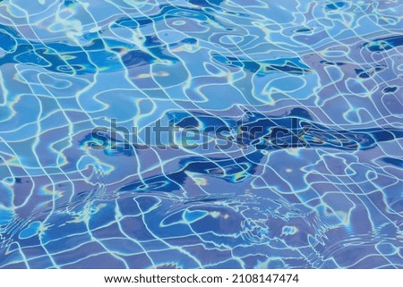 Swimming pool water background with reflection