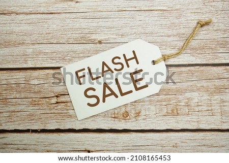 Flat lay Flash Sale tag with space copyon wooden background