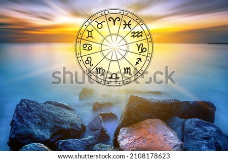 Zodiac signs inside of horoscope circle astrology and horoscopes concept Royalty-Free Stock Photo #2108178623