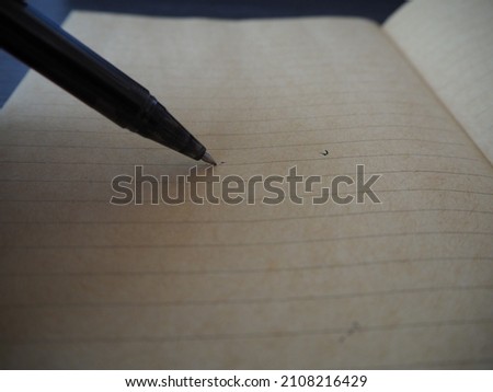 a pen on  empty notebook