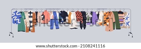 Used clothes on racks, hanging on secondhand store hanger rail. Garments mix on sale. Apparel leftovers assortment in stock shop, charity market. Isolated colored flat vector illustration of wearings Royalty-Free Stock Photo #2108241116
