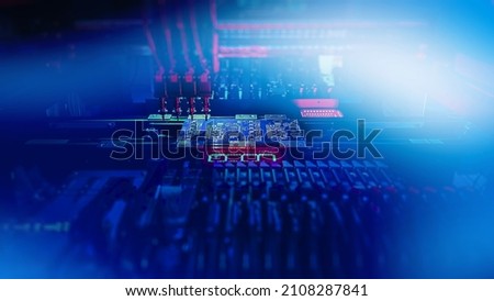 Automatic production of computer chips by SMT Pick and Place machine with Machine Vision System. Machine Vision System inspect PCB for components size and placement while Chip Production. Royalty-Free Stock Photo #2108287841