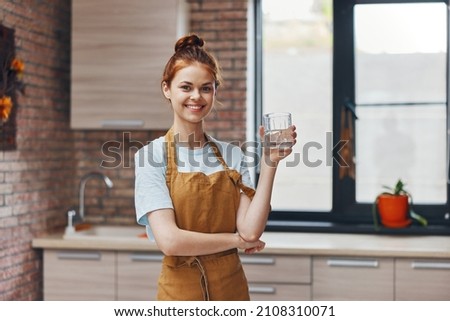 pretty woman kitchen glass of water apartment kitchen utensils interior unaltered