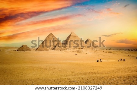 Egyptian pyramid in sand desert and clear sky Royalty-Free Stock Photo #2108327249