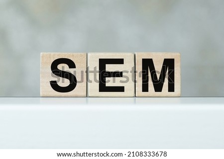 SEO Search Engine Optimization text wooden cube blocks on table background.