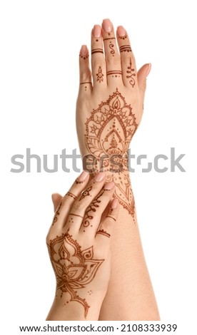 Beautiful female hands with henna tattoo isolated on white background Royalty-Free Stock Photo #2108333939