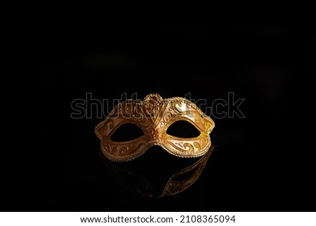 Luxury venetian mask on dark glitter background. Carnival masquerade fantasy mask Royalty-Free Stock Photo #2108365094
