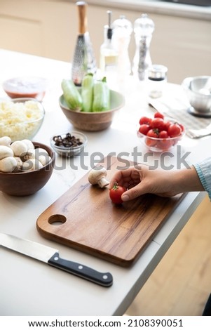 Meal prepa, a woman preparing food with vegetables in the kitchen
