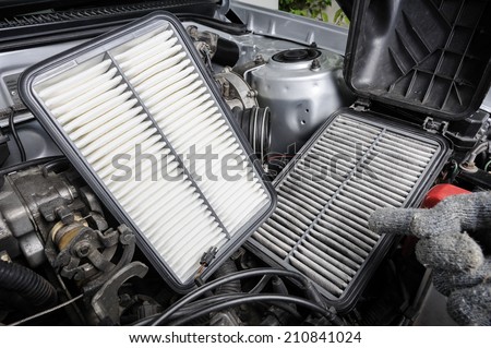 comparison between new and used air filter for car, automotive spare part  Royalty-Free Stock Photo #210841024