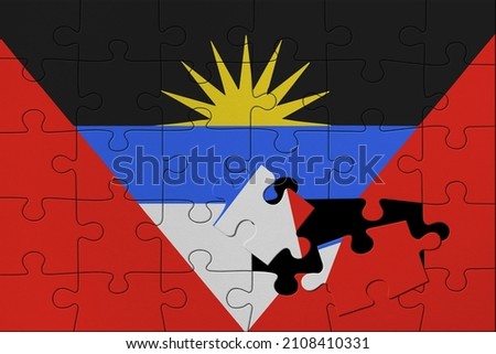 World countries. Broken puzzle- background in colors of national flag. Antigua and Barbuda