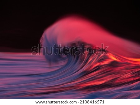 wave tube with spray breaking at sunset with in camera panning technique