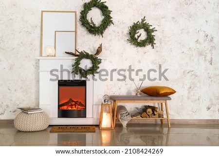 Modern fireplace decorated for Christmas eve