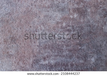 Red brown and rough surface of rock, pale and dirty red brown rock background.
