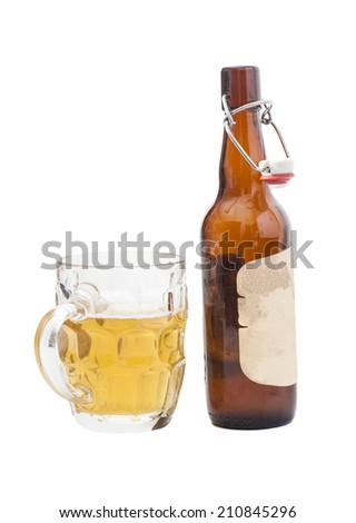 Mug of beer with  open half filled brown bottle of beer
