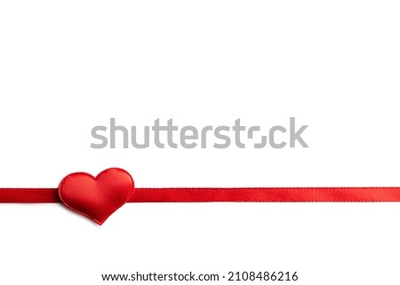 Creative Valentines Day postcard design with red ribbon and red textile heart on white background isolated. Valentine day and love concept Royalty-Free Stock Photo #2108486216
