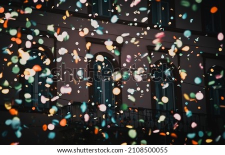 background of confetti in the air celebration in the city