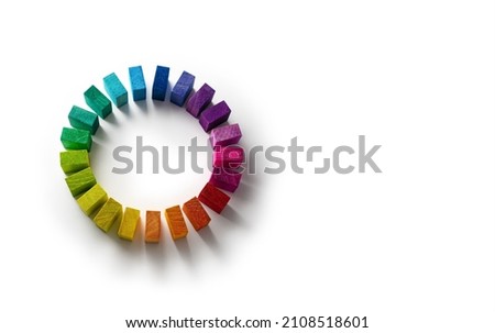 Color wheel of wooden blocks on pure white background, . Colors of unity. Circle of colored blocks representing unity of diverse elements. Wooden blocks placed in a a circle.